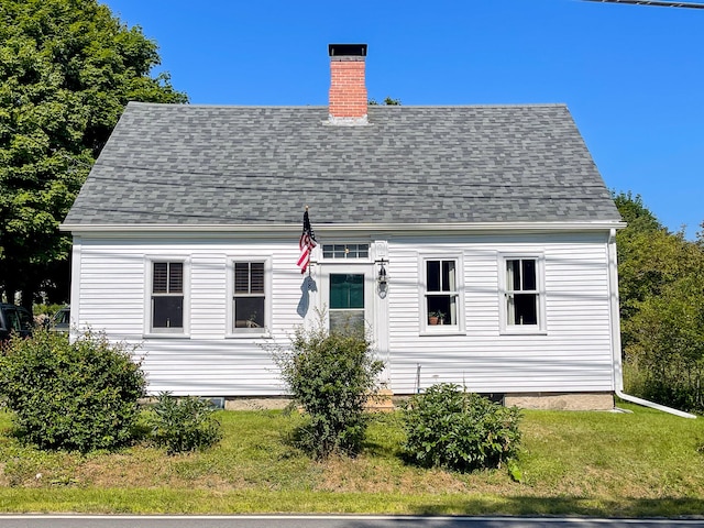 rear view of house with a lawn