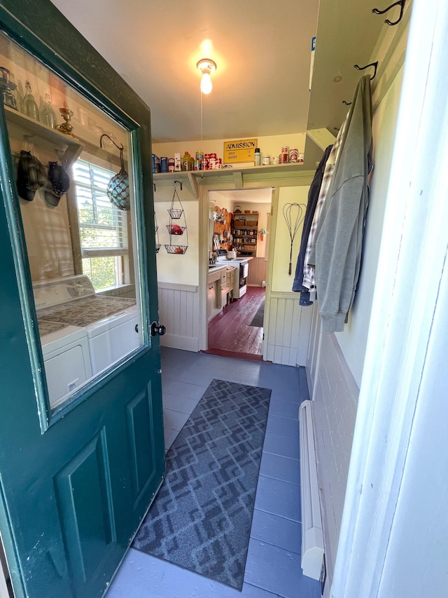 entryway featuring washing machine and dryer and wood-type flooring