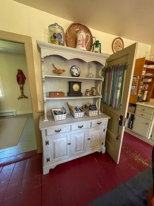 interior details with baseboard heating and wood-type flooring