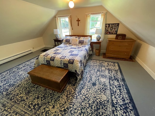 bedroom featuring a baseboard heating unit and vaulted ceiling