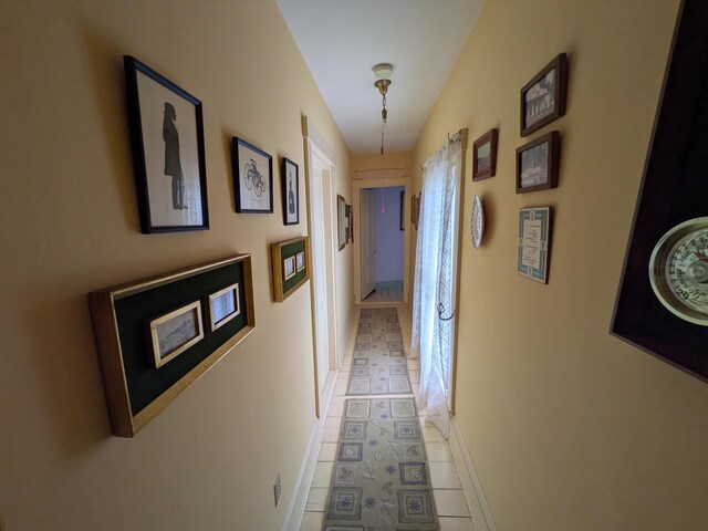 corridor with tile patterned flooring