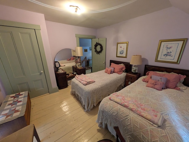 bedroom featuring a closet and light wood-type flooring