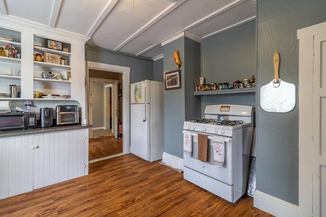 kitchen featuring hardwood / wood-style floors and white appliances