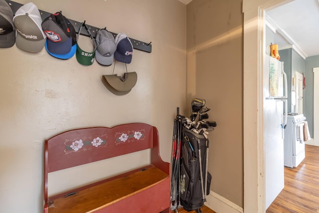 interior space featuring ornamental molding and wood-type flooring