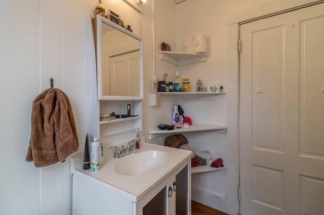 bathroom with hardwood / wood-style flooring and vanity