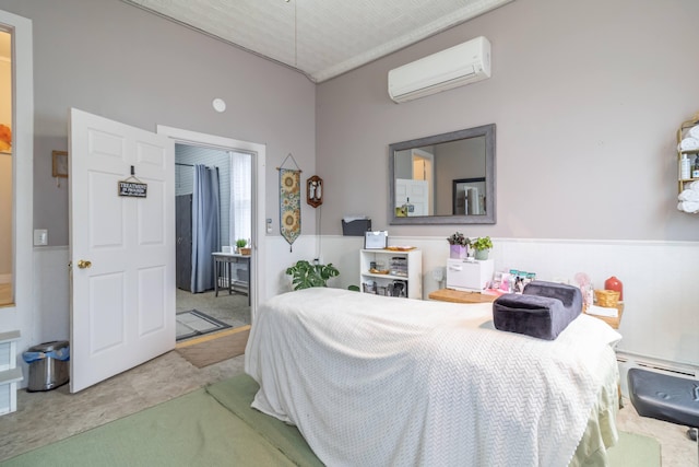 bedroom with light tile patterned floors and a wall unit AC