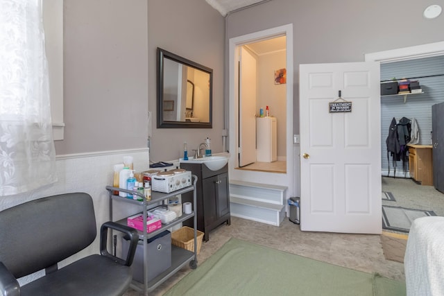 carpeted home office with sink