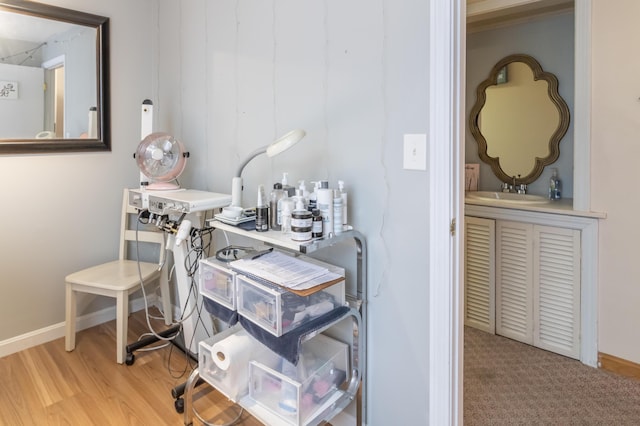 interior space with sink and light hardwood / wood-style floors