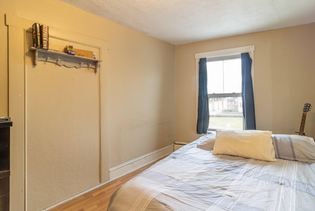 bedroom with light hardwood / wood-style floors