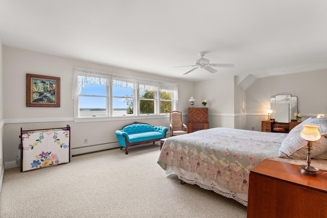 carpeted bedroom with baseboard heating and ceiling fan