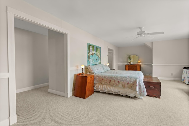 bedroom featuring ceiling fan and light colored carpet