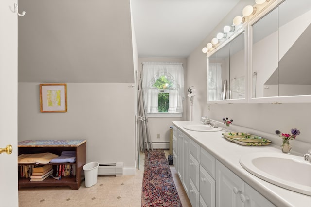 bathroom with lofted ceiling, vanity, and a baseboard radiator