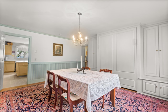 dining space featuring a chandelier and light hardwood / wood-style flooring