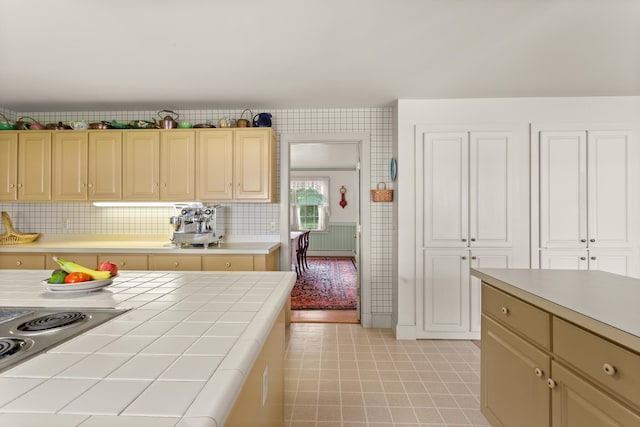 kitchen featuring stovetop and tile counters