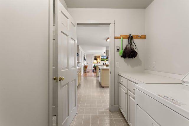 corridor with light tile patterned floors