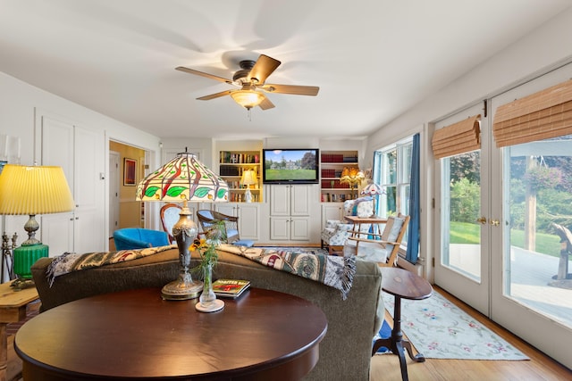 dining area featuring hardwood / wood-style floors and ceiling fan