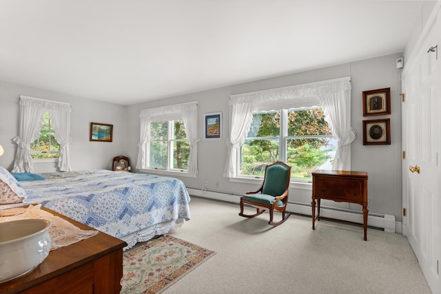 carpeted bedroom featuring baseboard heating