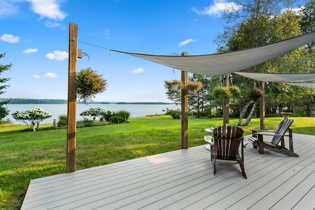 wooden deck featuring a yard and a water view