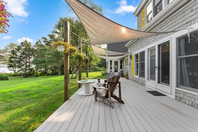 wooden deck with a yard