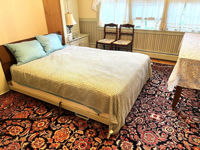 bedroom with dark hardwood / wood-style floors