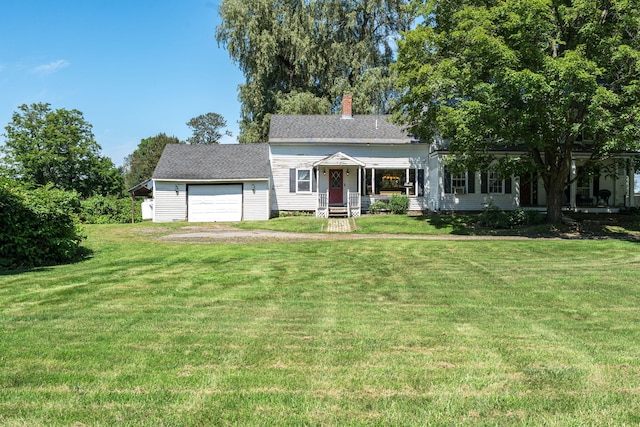 view of front facade featuring a front yard and a garage