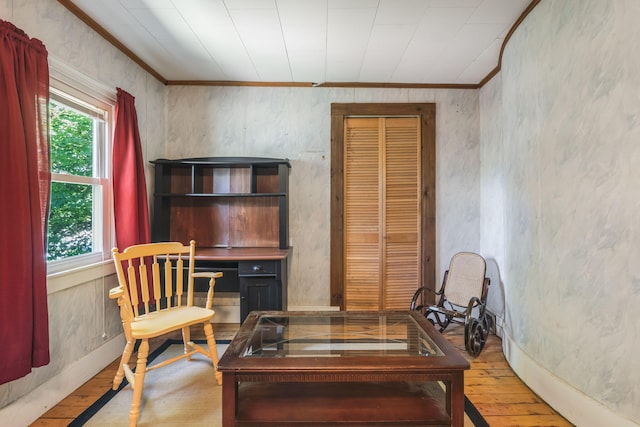 office area featuring light wood-type flooring and ornamental molding