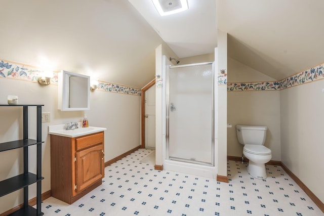 bathroom with vanity, lofted ceiling, a shower with door, and toilet