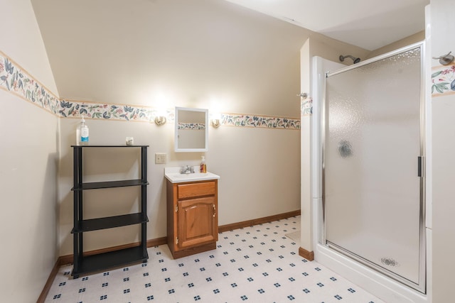 bathroom with tile patterned floors, vanity, vaulted ceiling, and an enclosed shower