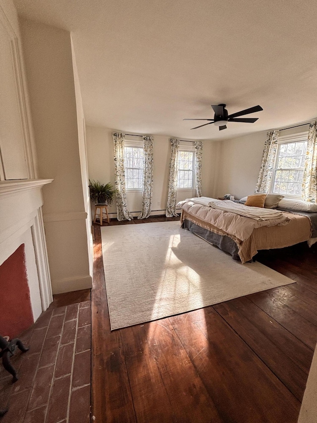 unfurnished bedroom featuring ceiling fan and dark hardwood / wood-style floors