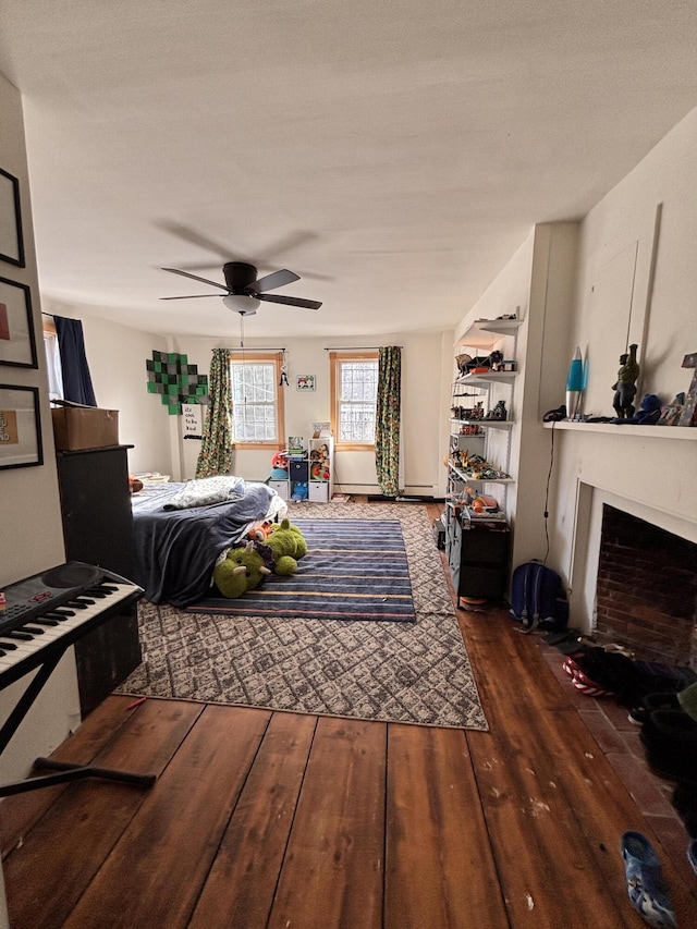 bedroom with dark hardwood / wood-style floors and ceiling fan