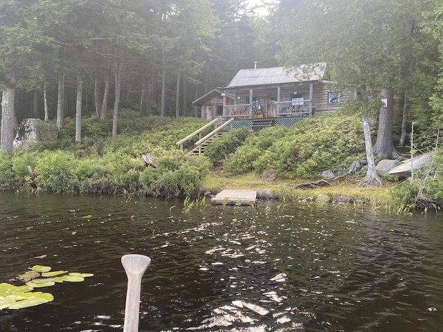 LOT14 Rowe Pond Rd, Pleasant Ridge Plt, ME 04920 - dock area featuring stairs, a wooded view, and a water view