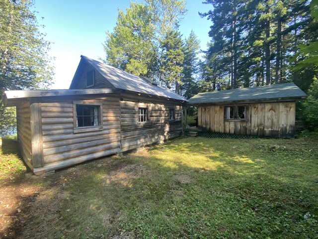 LOT14 Rowe Pond Rd, Pleasant Ridge Plt, ME 04920 - view of side of home featuring an outdoor structure and a yard
