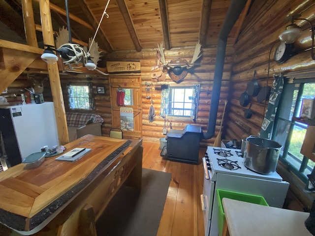LOT14 Rowe Pond Rd, Pleasant Ridge Plt, ME 04920 - kitchen with rustic walls, wood ceiling, hardwood / wood-style flooring, plenty of natural light, and white gas range