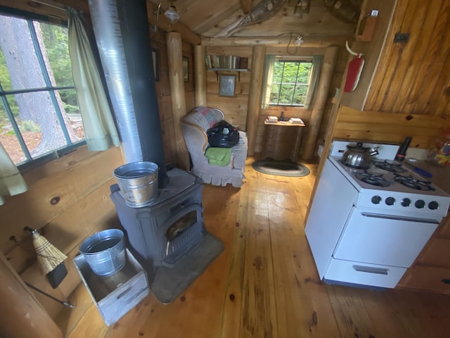 LOT14 Rowe Pond Rd, Pleasant Ridge Plt, ME 04920 - clothes washing area with a wood stove and wood-type flooring