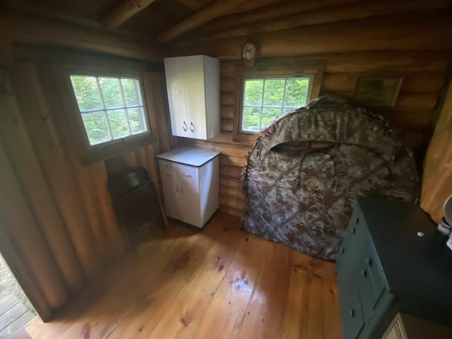 LOT14 Rowe Pond Rd, Pleasant Ridge Plt, ME 04920 - sitting room featuring log walls, light wood finished floors, and beam ceiling