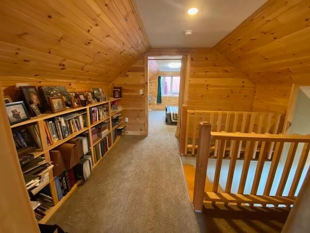 bonus room featuring carpet, lofted ceiling, wooden walls, and wood ceiling