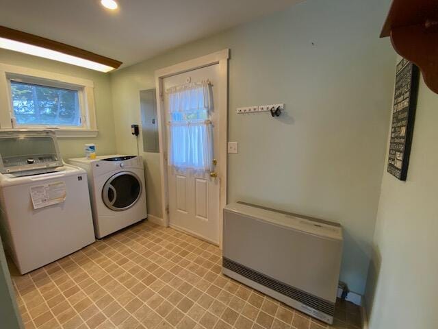 laundry area featuring plenty of natural light, separate washer and dryer, and heating unit