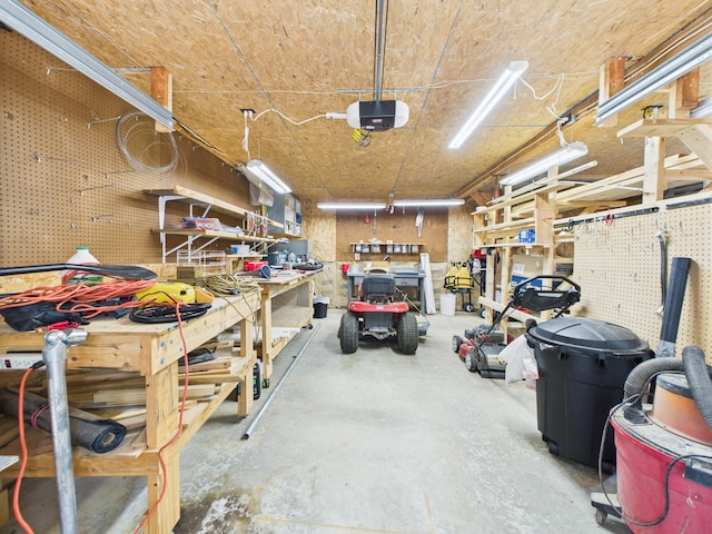 827 Little Madawaska Lake Rd, Westmanland, ME 04783 - garage featuring a workshop area and a garage door opener