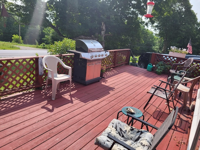 deck featuring a grill