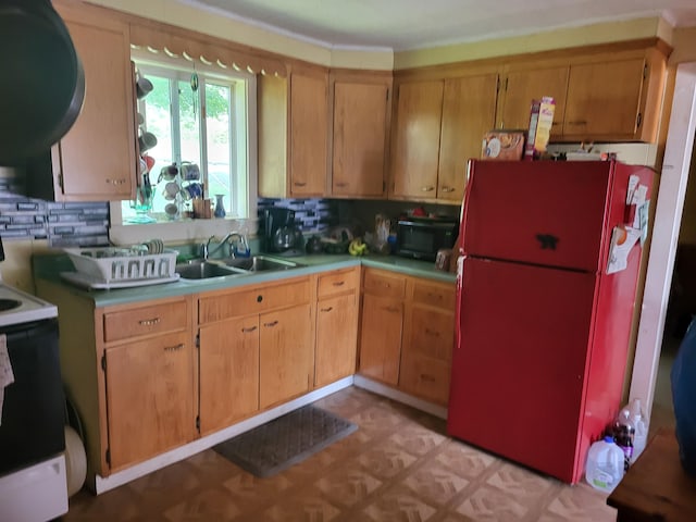 kitchen featuring backsplash, sink, and white appliances