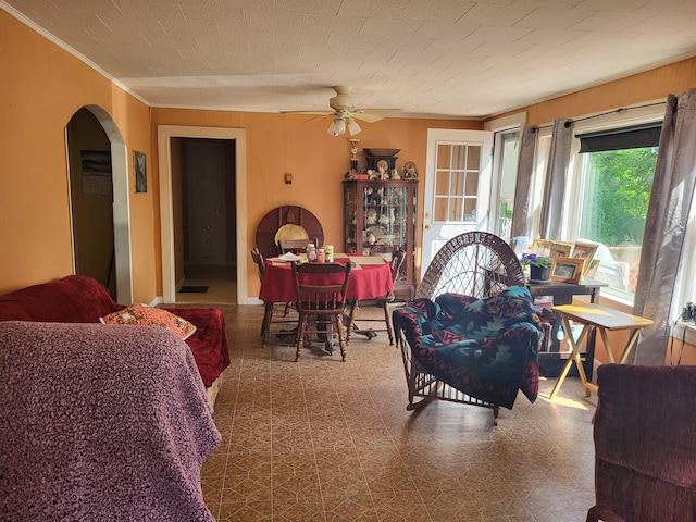 dining room with crown molding and ceiling fan