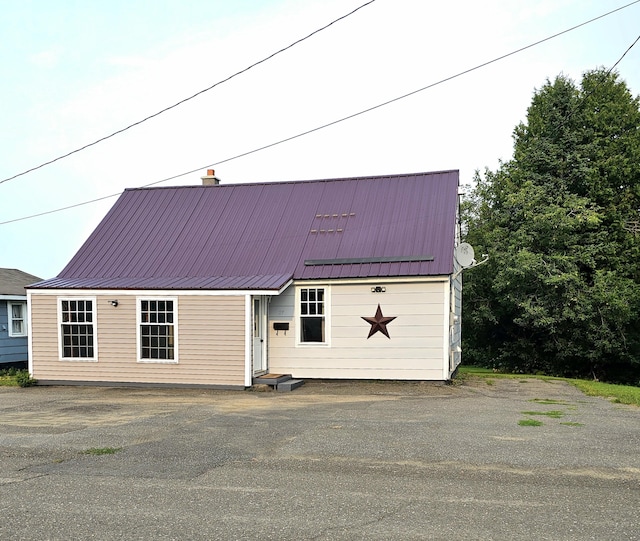 dutch colonial with metal roof