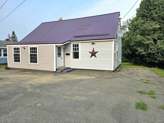 view of front of house featuring metal roof