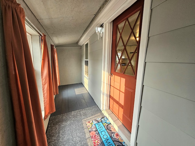 hallway with dark hardwood / wood-style flooring