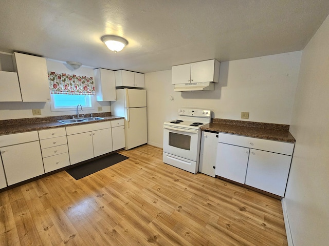 kitchen with under cabinet range hood, white appliances, a sink, white cabinetry, and dark countertops