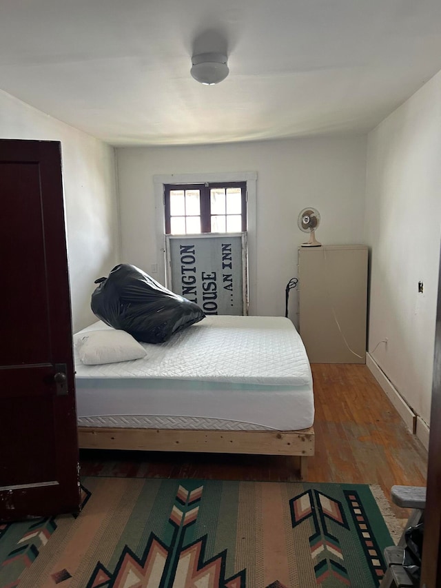 bedroom featuring hardwood / wood-style flooring