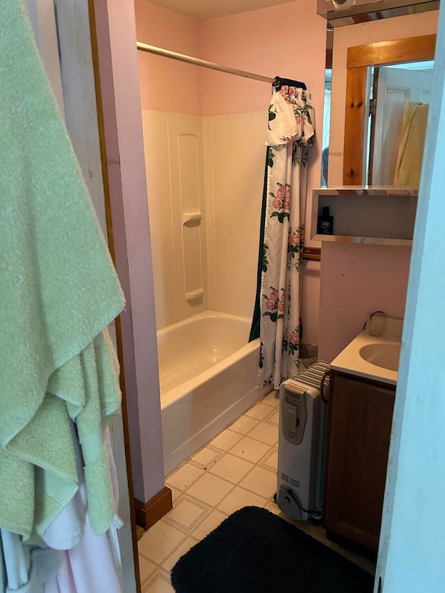 bathroom with tile patterned floors, vanity, and shower / bath combination with curtain