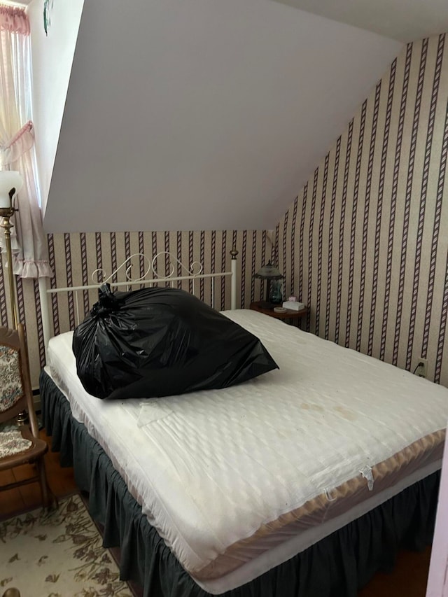 bedroom featuring vaulted ceiling