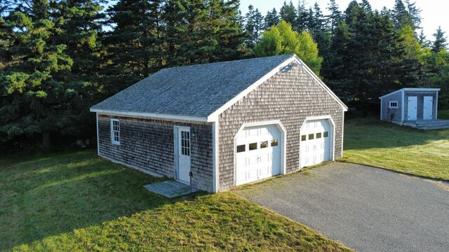 garage featuring a yard