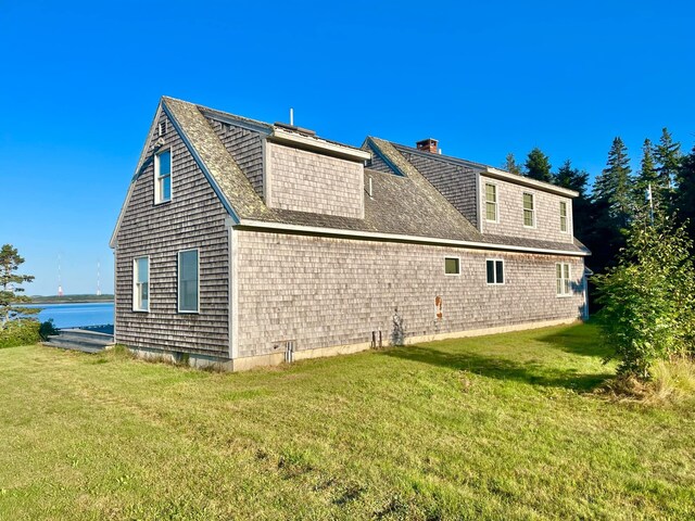 view of property exterior featuring a lawn